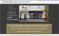 Home page screen shot showing the exterior of The Shop SRQ barbershop